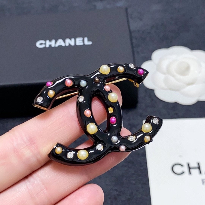 Ch**el brooches